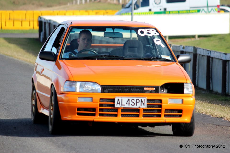 Orange 1988 Mazda 323 Gtae