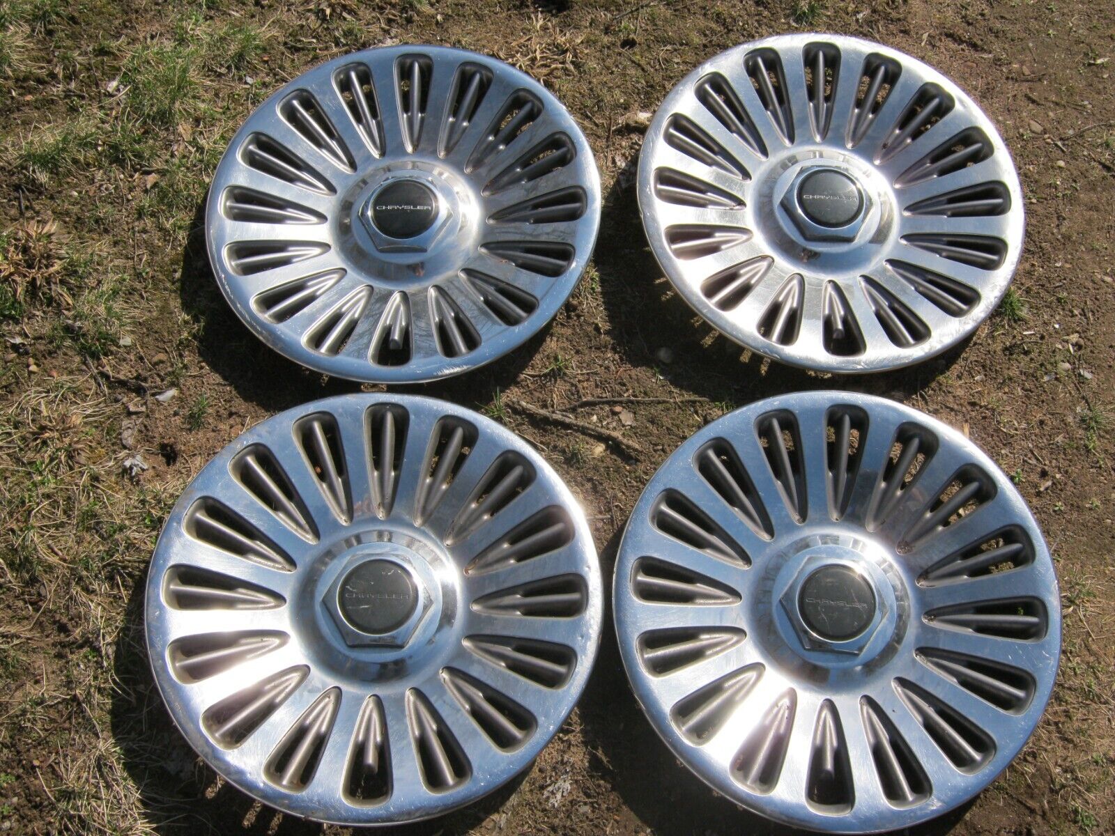 Genuine 1994 to 1996 New Yorker Concorde 16 inch metal hubcaps wheel covers