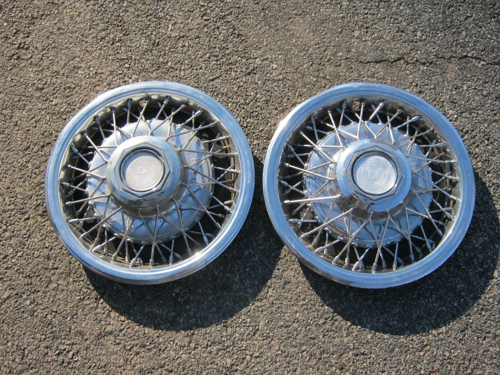 Genuine 1981 to 1983 AMC Concord 14 inch wire spoke hubcaps wheel covers