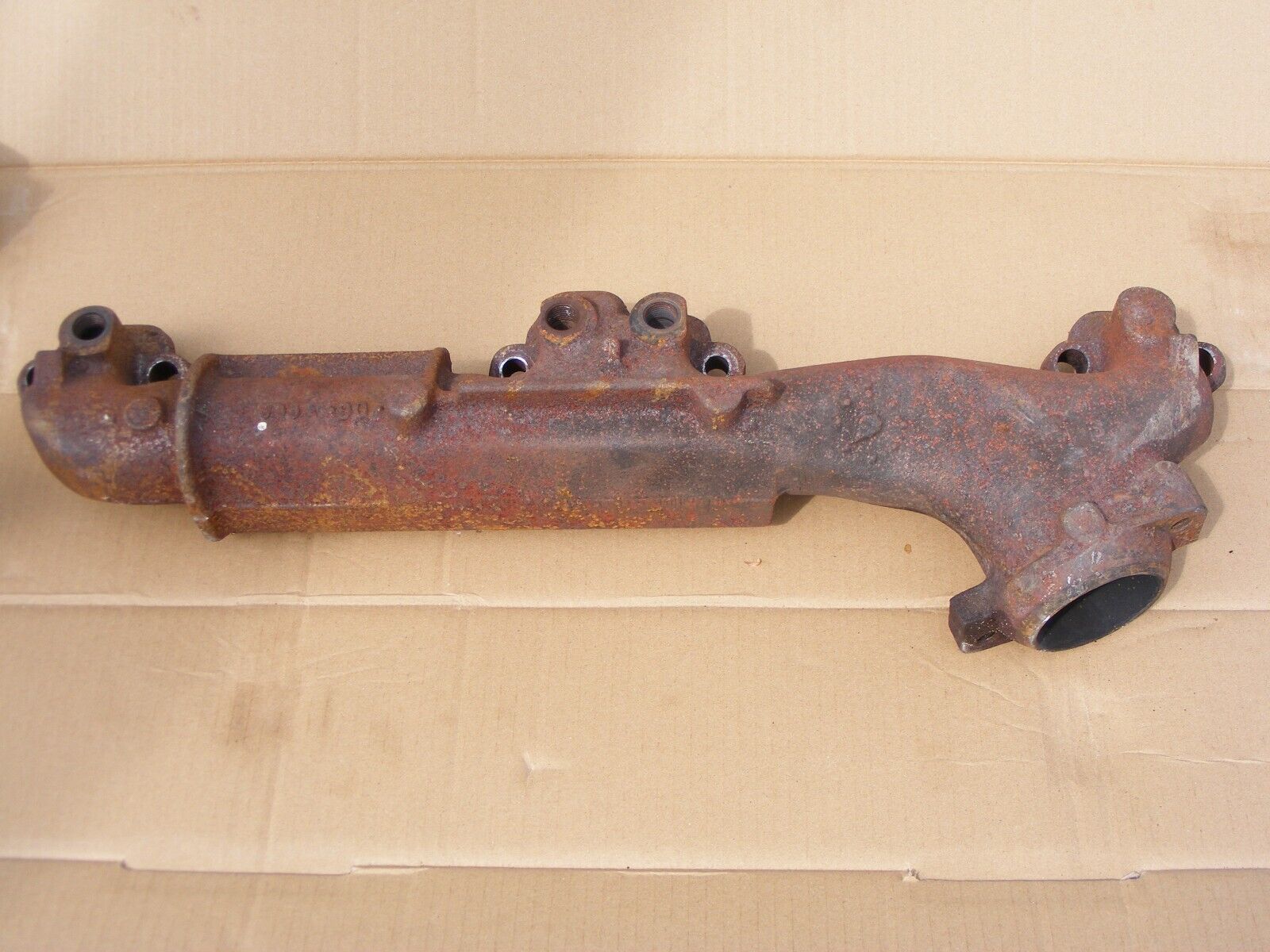 Jeep Grand Wagoneer driver side exhaust manifold- OEM-  9112