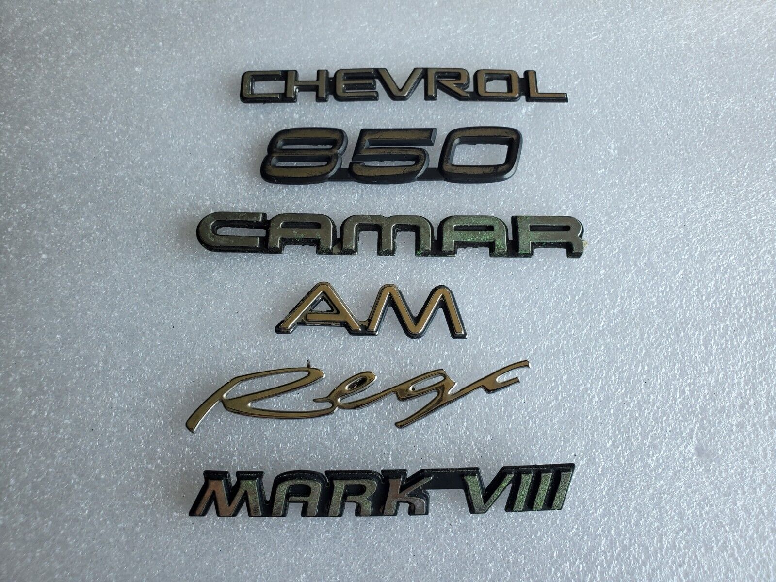 Misc Lot Of Emblwms Vintage Letters Logo OEM Mark VIII VOLVO Regal Camaro VNTG
