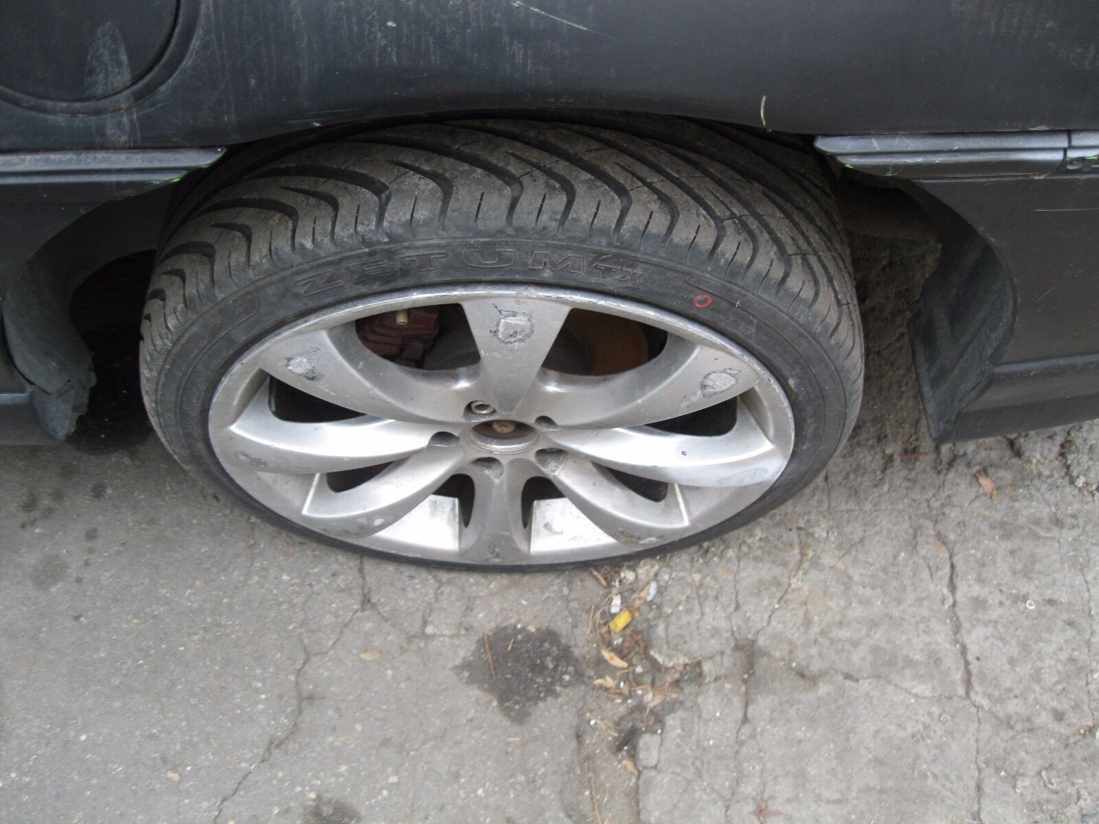 Fiero Pontiac USED after market Alloy Wheels  4 rough w/tires