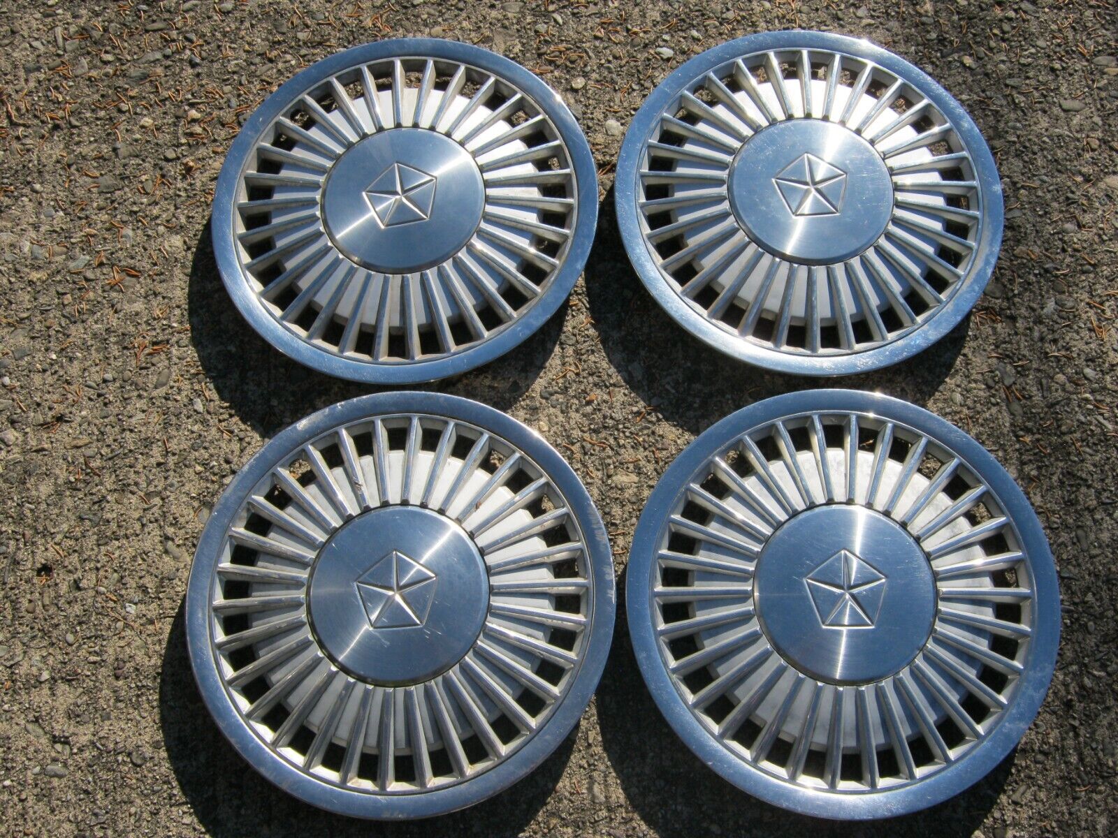 Genuine 1984 to 1988 Plymouth Voyager Caravelle 14 inch hubcaps wheel covers