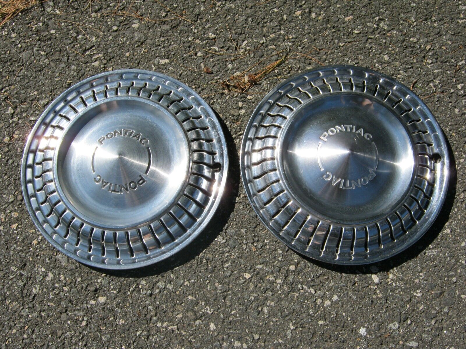 Factory 1975 to 1980 Pontiac Sunbird Astre 13 inch metal hubcaps wheel covers