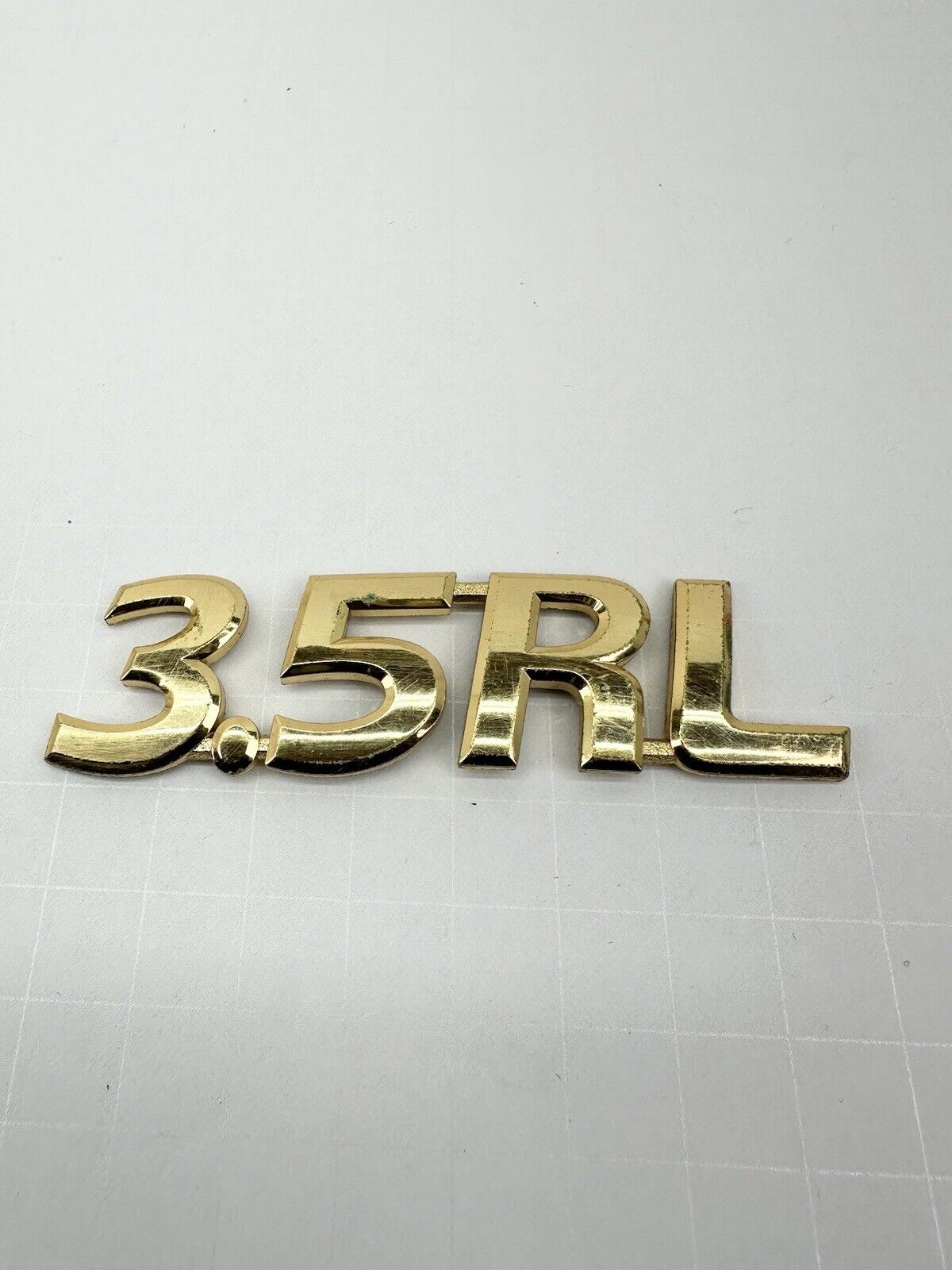 Acura 3.5RL OEM rear right 3.5RL logo emblem OEM GOLD