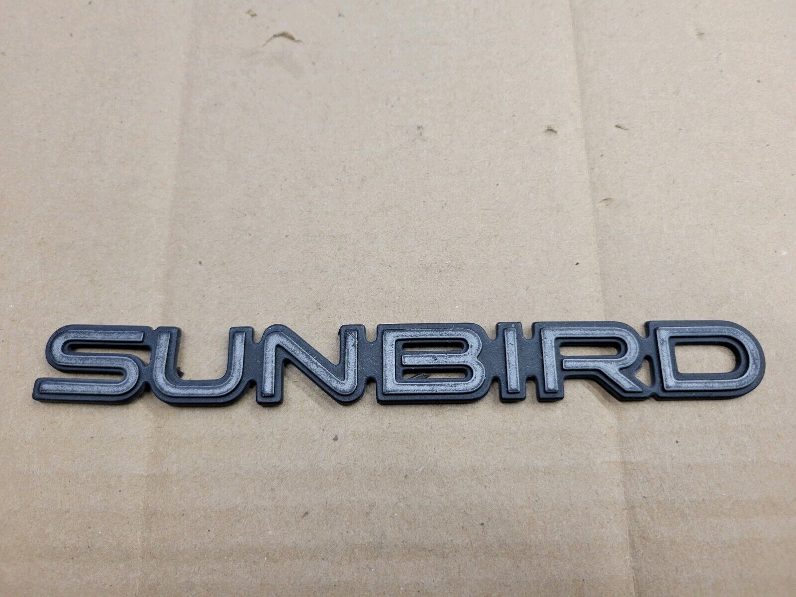 Pontiac OEM Sunbird Black Emblem Badge Logo Nameplate Name Insignia 20696847
