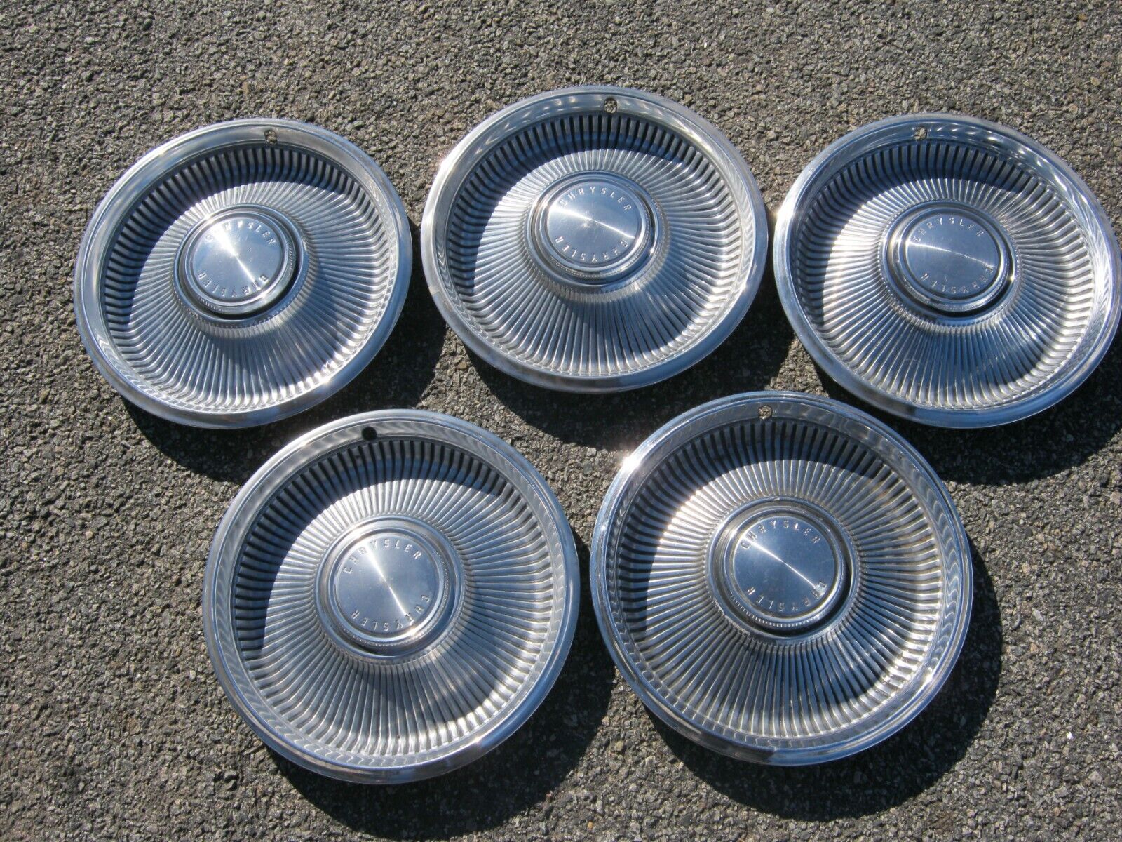 Lot of factory 1967 Chrysler New Yorker 14 inch hubcaps wheel covers