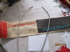 NOS 1976-1979 PONTIAC ASTRE 2 DOOR DOOR EDGE GUARDS-PART NO. 994071 picture