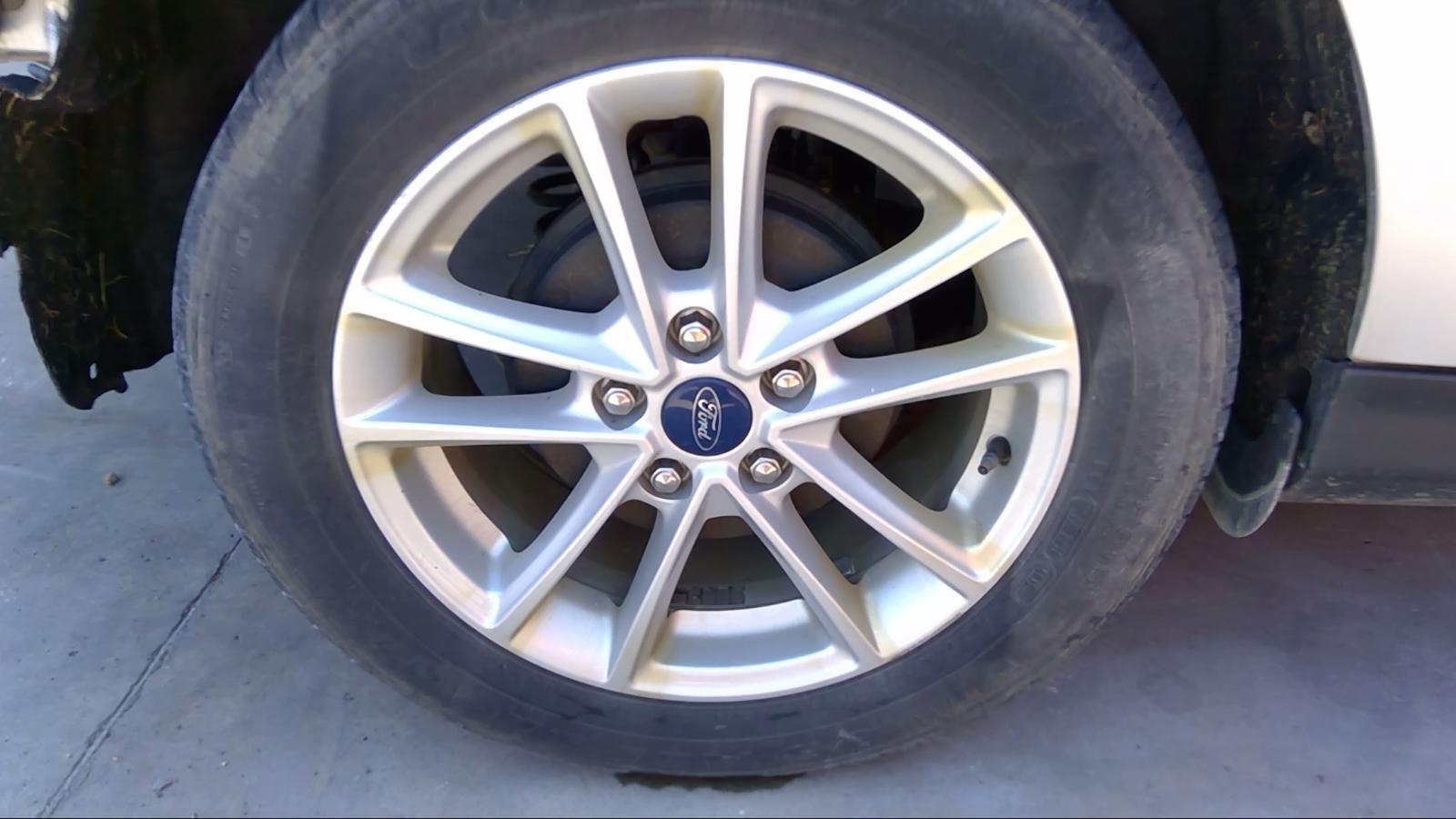 Used Wheel fits: 2017 Ford Focus 16x7 alloy 10 spoke painted silver Grade C