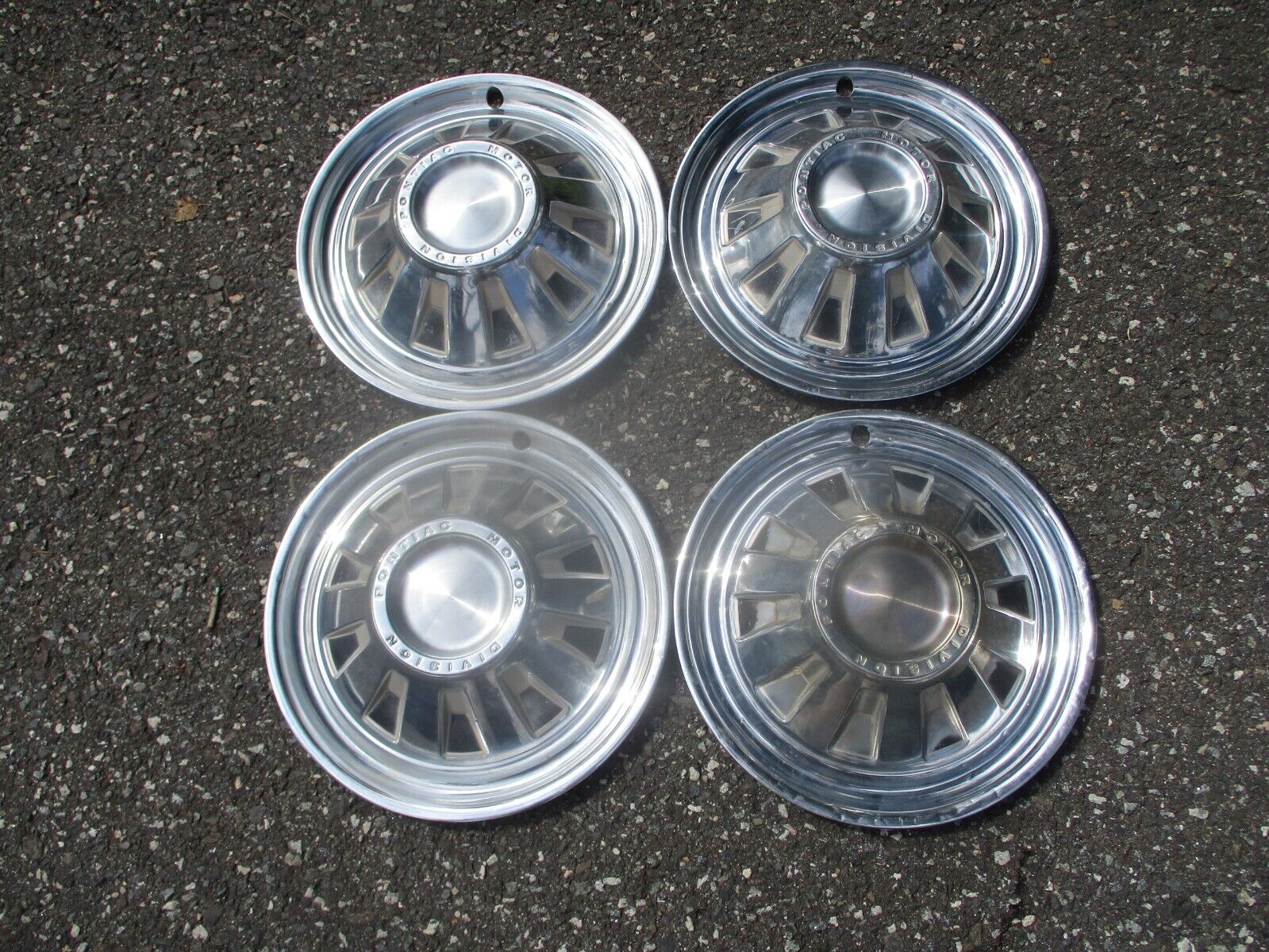 Factory original 1964 Pontiac Tempest 14 inch hubcaps wheel covers