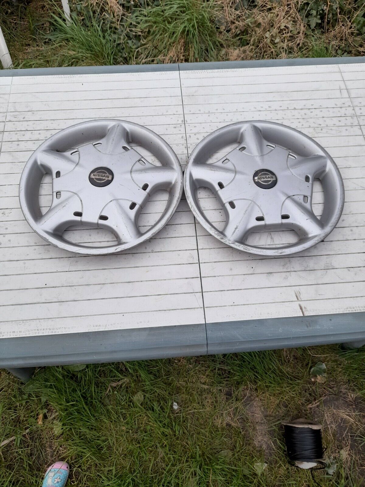  Nissan almera wheel trims hub caps wheel covers, genuine, 2x, two
