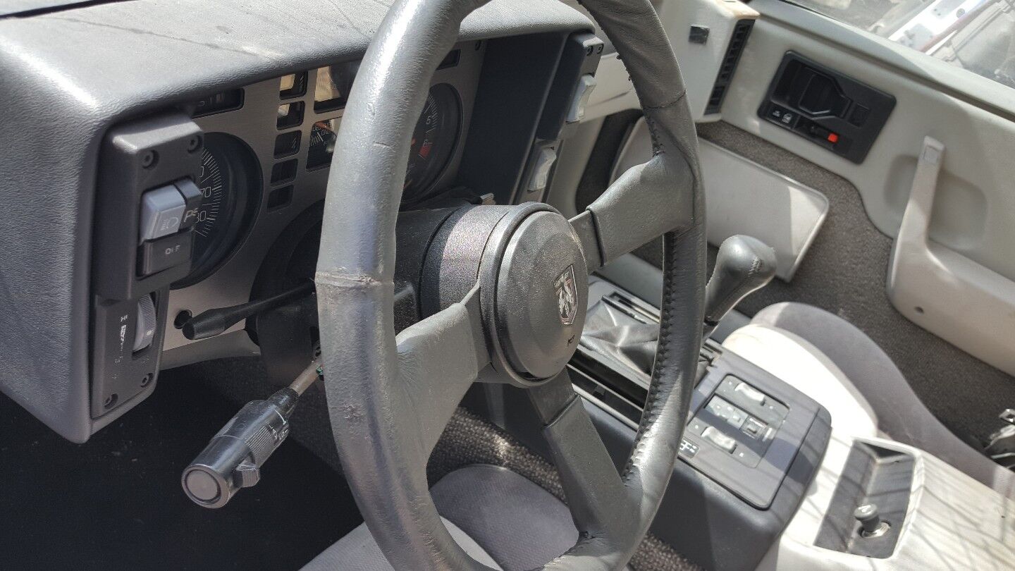 85 Pontiac Fiero Steering Wheel with Horn Button OEM