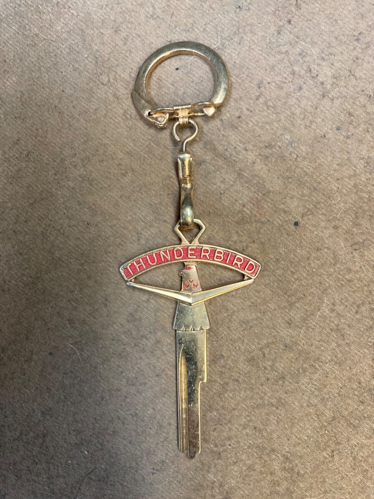 1955-1960 Thunderbird NOS vintage gold plated logo key chain w/ uncut key blank