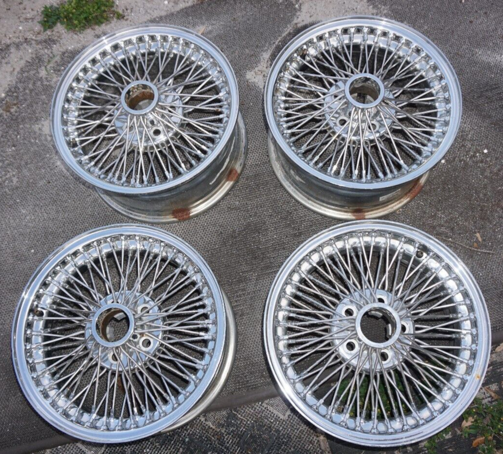 JAGUAR WIRE WHEELS OFF A 1993 XJS.  WILL FIT OTHERS SET OF FOUR SUPER CLEAN