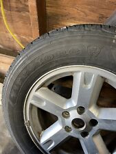 four tires with rims from a 07 dodge nitro. picture